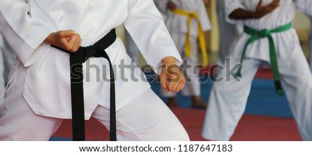 Taekwondo kids athletes. Moment of athlete to warm up and strike an opponent during the tournament taekwondo kids