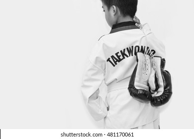 Taekwondo Kids Hold Boxing Gloves On White Background.