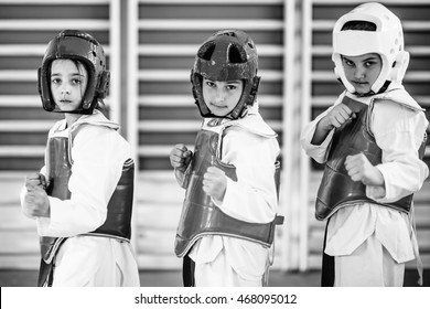 Taekwondo kids posing, looking at camera