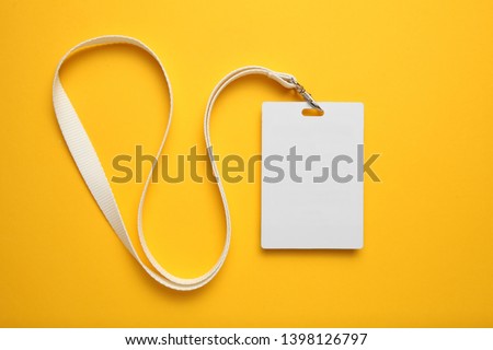 Tag id pass, plastic identification on yellow background. White blank badge mockup.