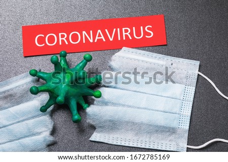 Tag with text, caronavirus and torn medical mask, top view. Concept on the COVID-19 pandemic Stock photo © 