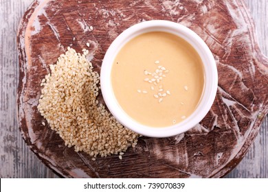 Tahini Paste - Sesame Sauce On Wooden Board