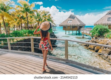 Tahiti Hotel Woman Tourist At Resort By Beach. Vacation Travel In Bora Bora, French Polynesia Landscape. Happy Elegant Lady Tourist Enjoying Summer Holiday