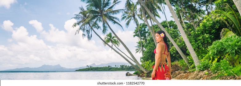 Tahiti luxury exotic travel vacation girl with polynesian flower walking on beach landscape with palm trees. Asian woman in red bikini and beachwear banner panorama. - Powered by Shutterstock