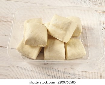 Tahu Putih Or Tofu In Plastic Container Isolated Against White Wooden Background. Copy Space Available. 