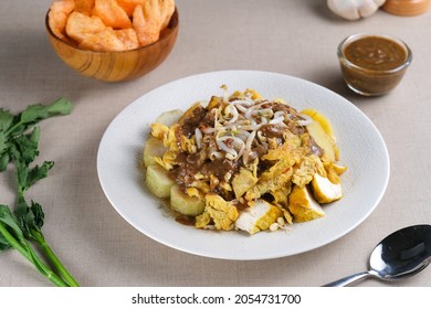 Tahu Tek is an Indonesian traditional food originating from Surabaya, East Java. Made from tofu, eggs, bean sprouts, rice cake, potatoes, and peanut sauce mixed with petis which is made from shrimp. 