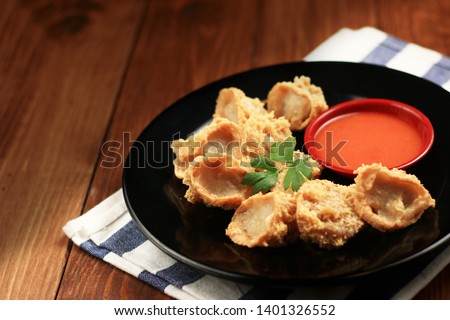 Tahu Walik (inside out tofu) is a processed tofu snack fried in starch and other ingredients. This snack origin from the Banyuwangi region, East Java, Indonesia