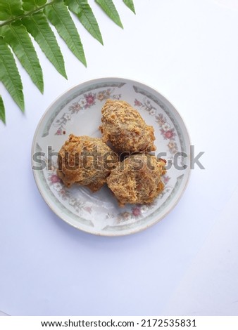 Tahu Walik. Local fried snacks made from deep-fried tofu. Then flip it over so that the inside of the tofu is on the outside. And tofu is filled with processed chicken and flour