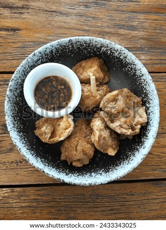 tahu walik or walik tofu is Indonesian food complete with chili sauce