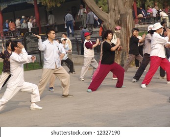 Tai Chi Public Exercising In The Morning In Beijing, China