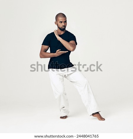 Tai chi, training and man in martial arts exercise or calm movement with hands on white background. Balance, workout and person with skill in self defence technique or healthy practice of action