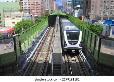  Taichung MRT train passes above the road.