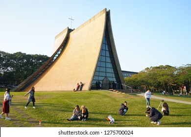 Taichung, Taiwan - Dec. 30, 2018: The Luce Chapel which is a landmark of Tunghai University. People take pictures in front of the church.