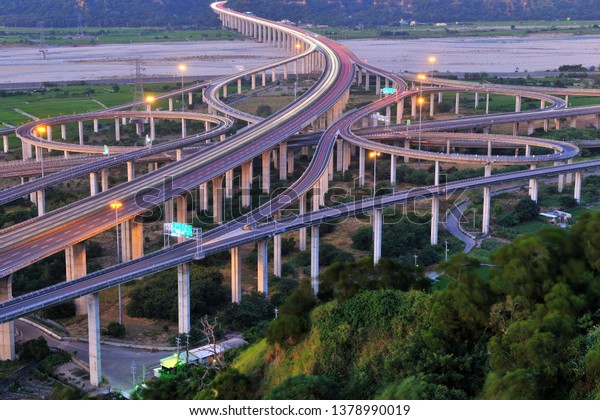 Taichung, Taiwan, diamond-type highway\
interchange, intricate highway lane\
landscape.