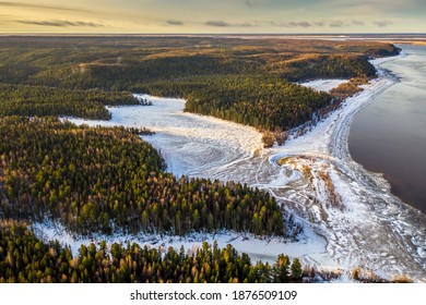 Taiga forest banks, ice and waters of the Siberian Ob River. Autumn time. Russia.