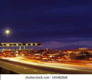 Tail backs of traffic at toll gate in California