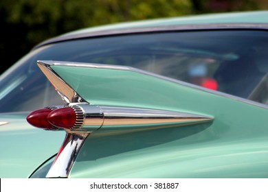 The tail fin of a classic automobile.