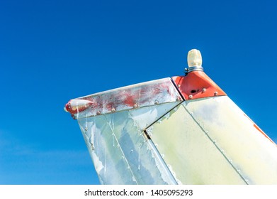 Tail Fin, Rudder And Beacon Lights, Small Single Engine Airplane With Old Paint And Bright Blue Sky.