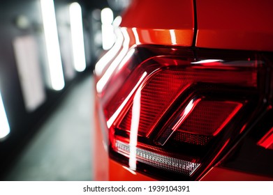 Tail Light Of Nice And New Orange Sport Suv Car In Modern Garage.