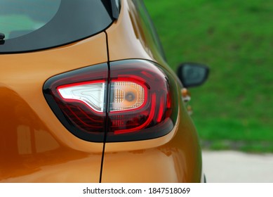 The tail lights on a luxury passenger car