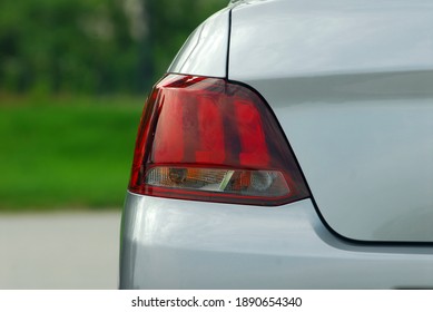 The tail lights on a luxury passenger car