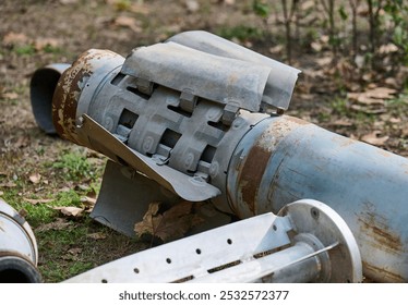 The tail section of a 220 mm rocket for the Uragan rocket fire system on a city flowerbed in Mykolaiv