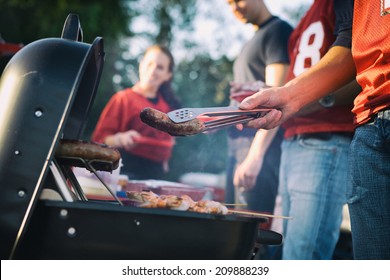 Tailgate: Man Works The Grill At Tailgating Party