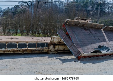 Tailgate Of Old Metal And Wood Industrial Truck Bed Laying On Ground.