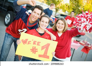 Tailgate: Three Friends Cheer And Hold Up Number One Sign