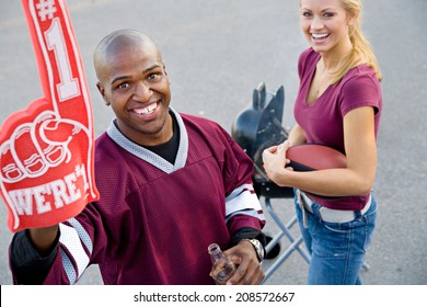 Tailgating: College Guy Holds Up Number One Foam Finger