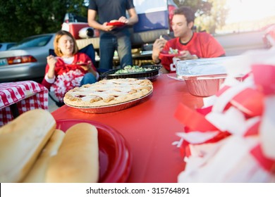 Tailgating: Focus On Apple Pie On Table Of Tailgate Party Food