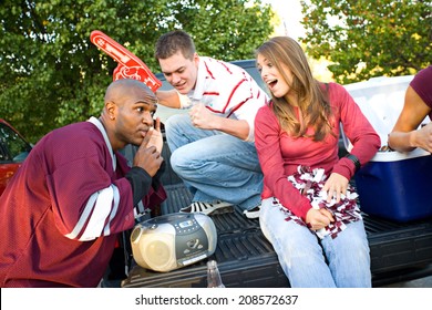 Tailgating: Group Of Fan Friends Listening To Game On Radio