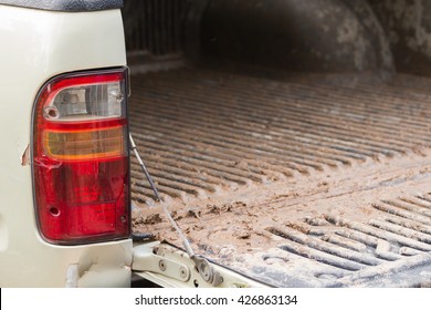 Taillights And Tailgate Of A Pickup Truck Dirty.