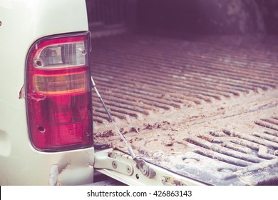 Taillights And Tailgate Of A Pickup Truck Dirty.