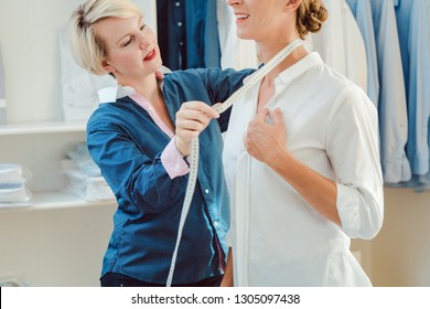 Tailor Measuring Neck Of Woman To Make Her A Bespoke Shirt