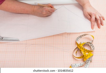 Tailor Traces The Hand Drawn Clothing Pattern On Tracing Paper