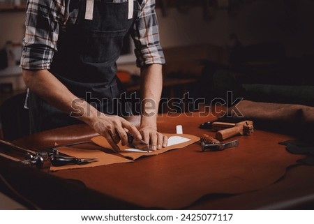 Tailor use tools for maker from natural leather product brown color in workshop. Concept shoemaker industry business.