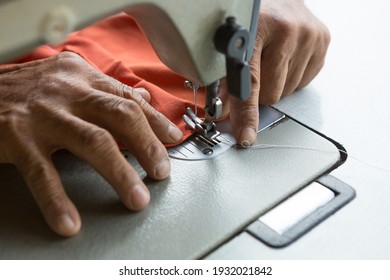 Tailor is using a sewing machine Sewing machine and copy space