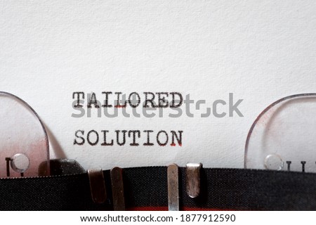 Tailored solution phrase written with a typewriter.