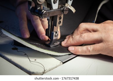 Tailoring Of Leather Products. Repair Of The Car Seat Cover.