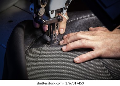 Tailoring Of Leather Products. Repair Of The Car Seat Cover.