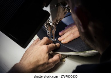 Tailoring Of Leather Products. Repair Of The Car Seat Cover.