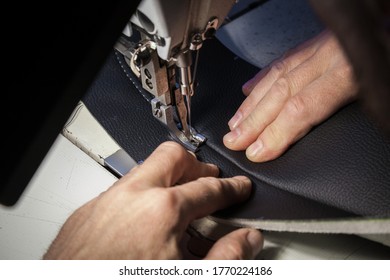 Tailoring Of Leather Products. Repair Of The Car Seat Cover.