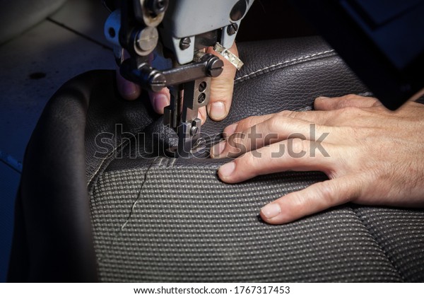 Tailoring of leather products. Repair of the car\
seat cover.