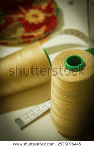 Tailoring spindle and meter on the table