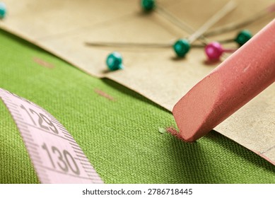 tailor's chalk tracing the pattern onto fabric.