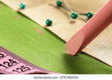 tailor's chalk tracing the pattern onto fabric. Clothing and fashion industry work, tailor's , hobby.