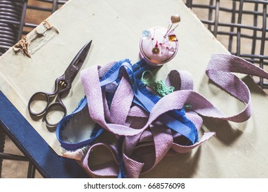 Tailor's kit: scissors, braid, pins. Vintage style.