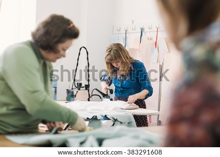 Similar – Caregiver checking blood pressure to a senior woman