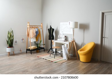 Tailor's workplace with mannequin in modern atelier - Shutterstock ID 2107808600